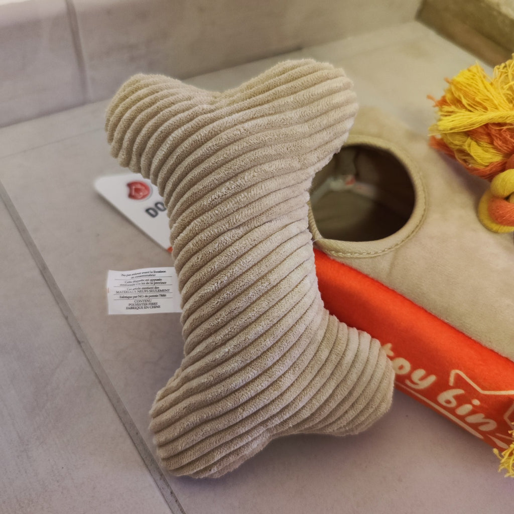 Peluche pour chien intégrée dans une boîte de jeu interactive